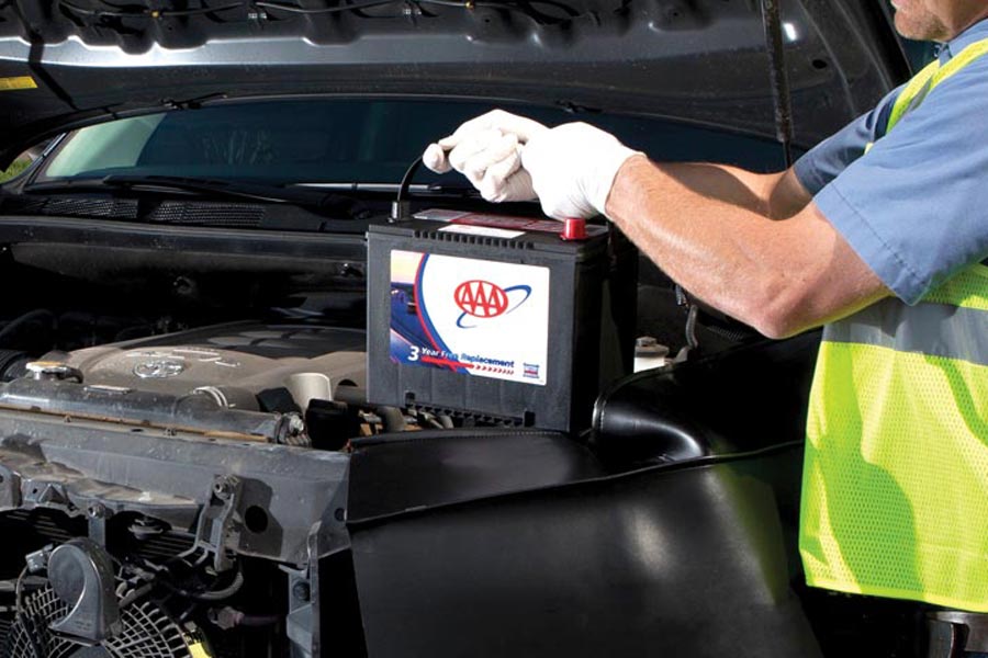 AAA technician replacing a car battery