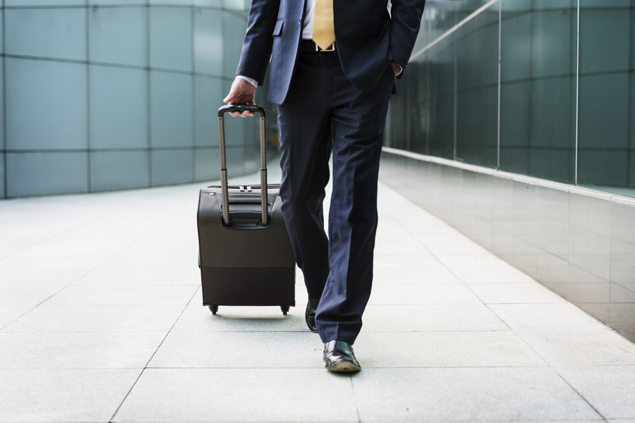 Businessman in suit with suitcase