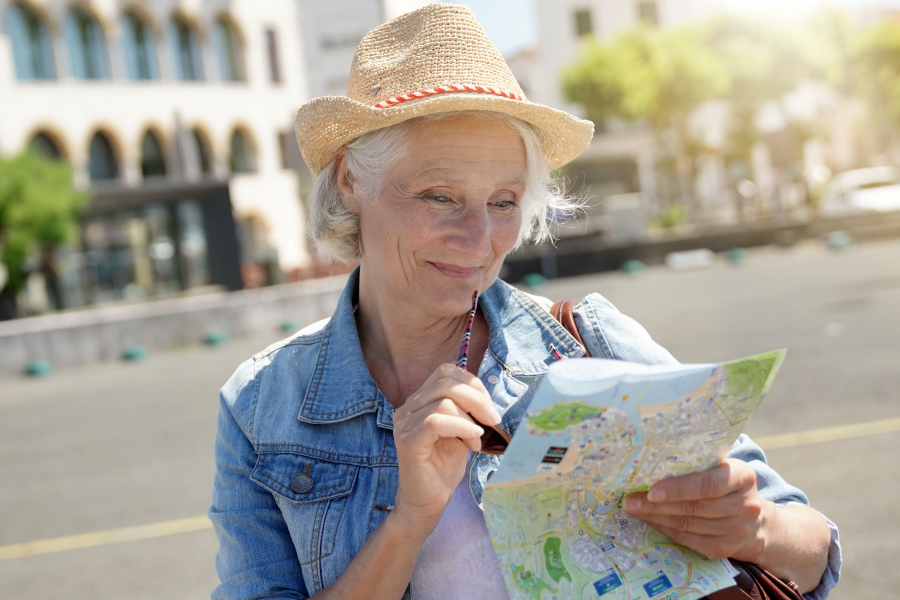 Older woman looking at a map