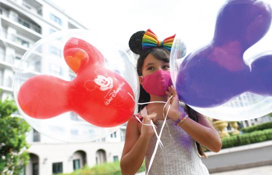 girl with balloons at walt disney world resort hotels
