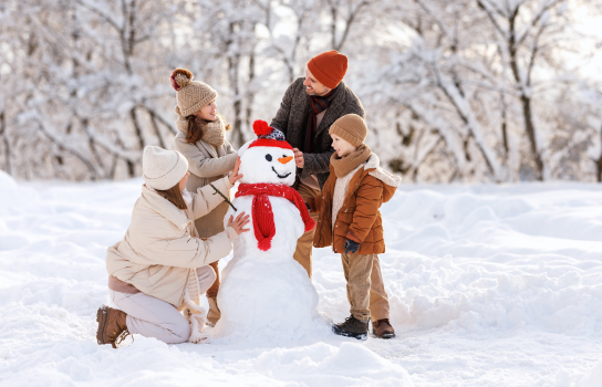 Family making snowman